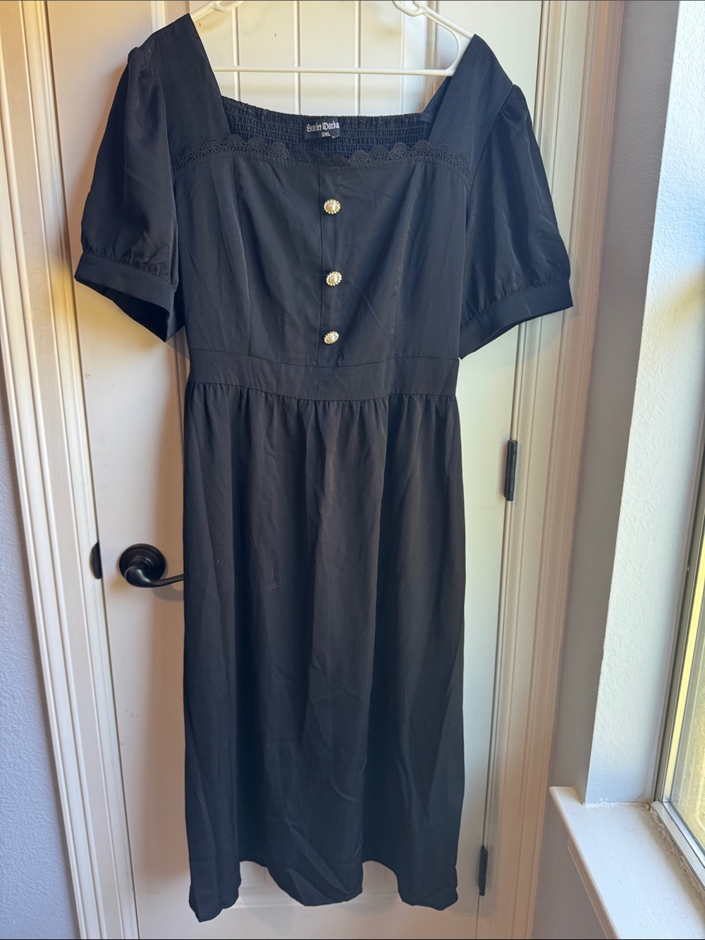 Square-Neck Black Midi Dress with Puff Sleeves and Decorative Buttons